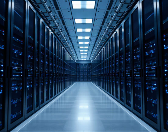 Interior of a modern data center with rows of servers, representing AI and high-performance computing infrastructure.