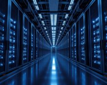 Interior of a large AI data center with rows of servers and blue lighting