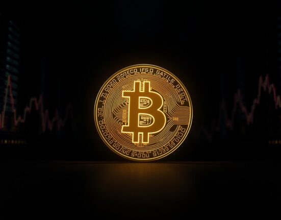 Bitcoin coin glowing against dark financial charts and data center background