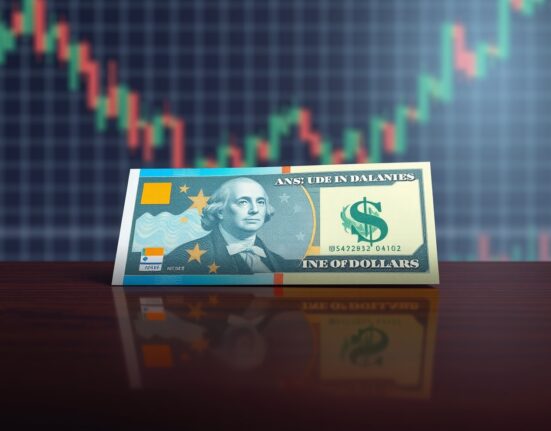 Australian and US dollar banknotes on a dark desk with soft lighting, representing AUD/USD forex trading.