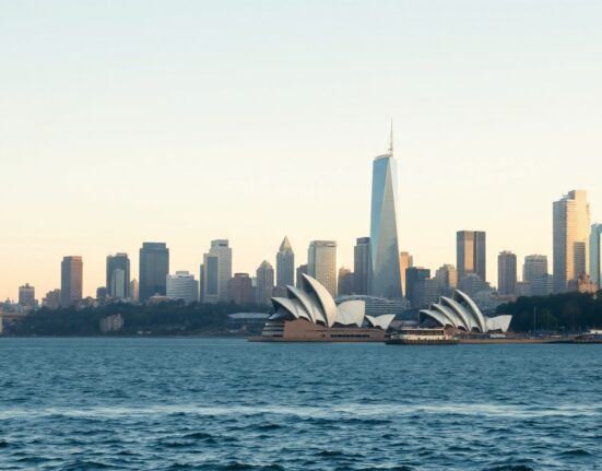 Sydney skyline and Opera House with harbor, representing Australia's economic activity