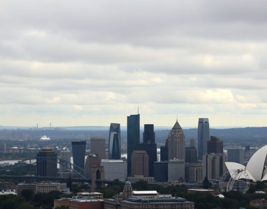 Sydney skyline on overcast day reflecting economic slowdown in Australia