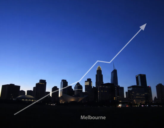 Melbourne skyline at dusk with an upward-trending graph line overlay symbolizing rising inflation in Australia.