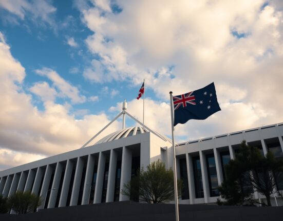 Australian Parliament House in Canberra with flag flying under partly cloudy sky