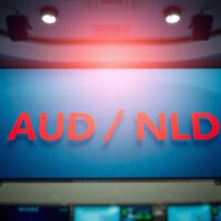 AUD/NZD currency pair on a digital trading screen with downward trend indicators