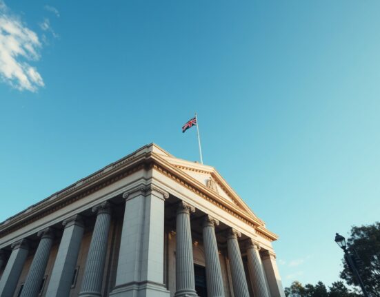 Reserve Bank of Australia building in Sydney on a clear day, representing monetary policy decisions.