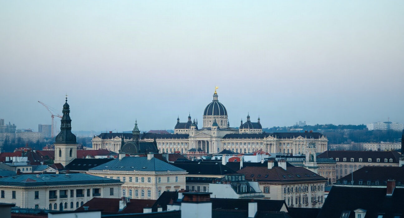 Vienna skyline at dusk, representing Austria's economic landscape amid rising unemployment.