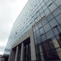 Bank of Canada headquarters in Ottawa under overcast sky, representing monetary policy decision
