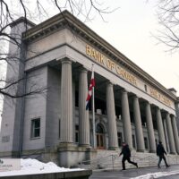 Bank of Canada building in Ottawa on a cloudy winter day, symbolizing a pending interest rate decision.