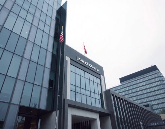 Exterior view of the Bank of Canada headquarters in Ottawa on a cloudy day