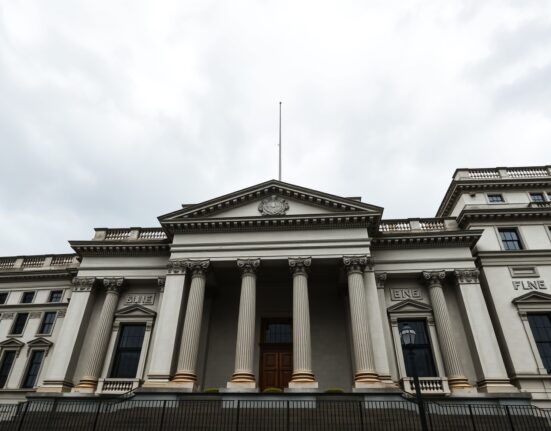 Bank of England building in London with financial charts overlay, representing active hold policy and June risks analyzed by Rabobank.