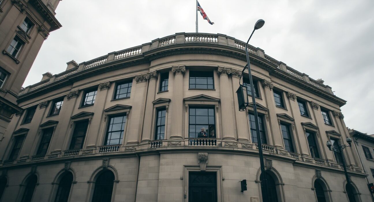 Bank of England building in London under overcast sky, representing UK monetary policy analysis.
