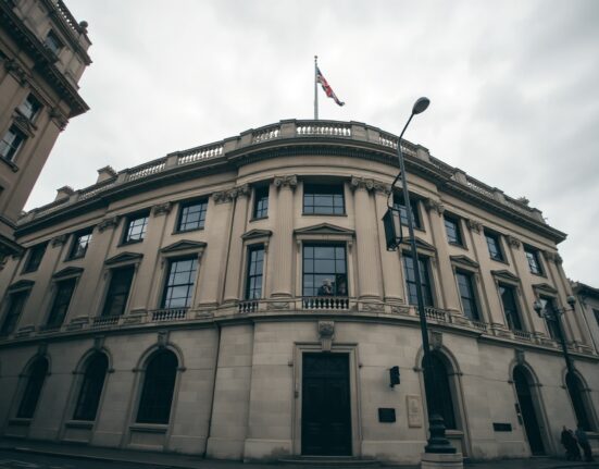 Bank of England building in London under overcast sky, representing UK monetary policy analysis.