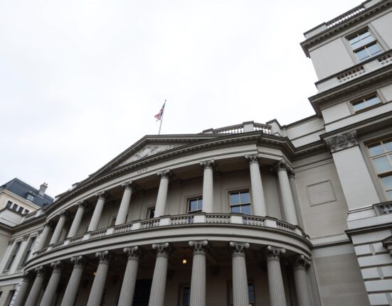 Bank of England building on Threadneedle Street, London, on a cloudy day.