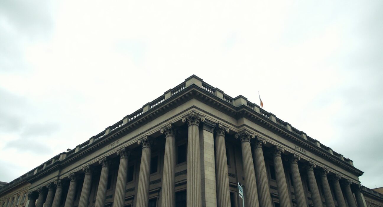 Exterior of the Bank of England building in London under overcast sky