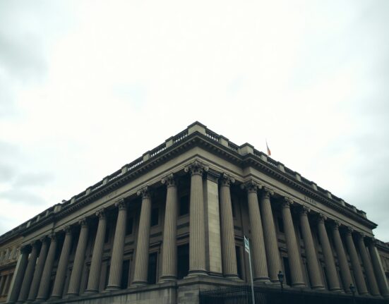 Exterior of the Bank of England building in London under overcast sky