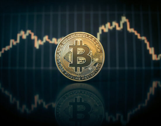 Bitcoin coin with a subtle price chart in the background, symbolizing market analysis
