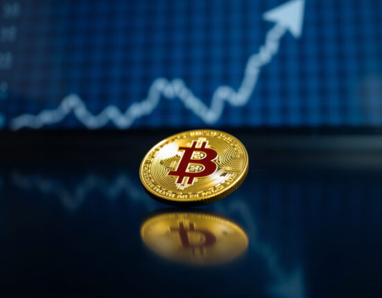 Bitcoin coin with price chart in background symbolizing market recovery
