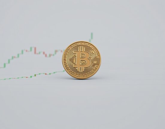 Bitcoin coin resting on a financial chart illustrating the 100-day moving average support level at $72,000.