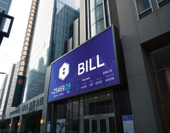 Seoul financial district building with digital display showing BILL cryptocurrency price charts