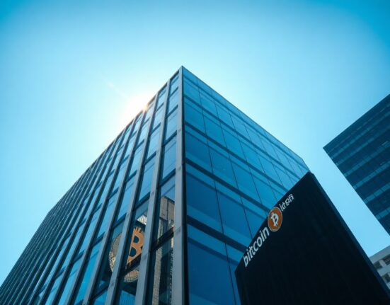 Modern financial office building with subtle Bitcoin reflection, representing BlackRock's crypto operations