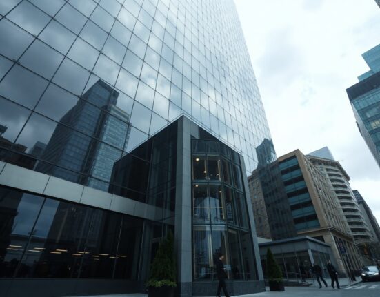 Exterior of a modern financial district office building, representing BlackRock's headquarters, under overcast daylight.