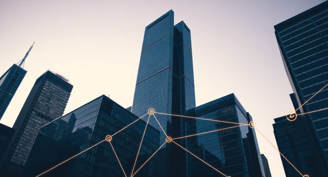 Modern financial district skyline with digital blockchain overlay representing tokenized assets