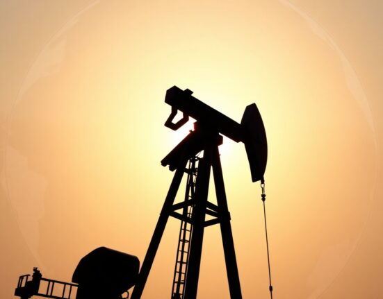 Oil pumpjack silhouetted against a sunset, representing cautious Brent crude trade amid geopolitical risks.