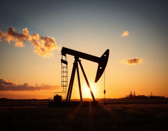 Oil pumpjack silhouette at dusk representing Brent crude market dynamics
