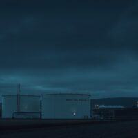 Brent crude oil storage facility at dusk under overcast sky