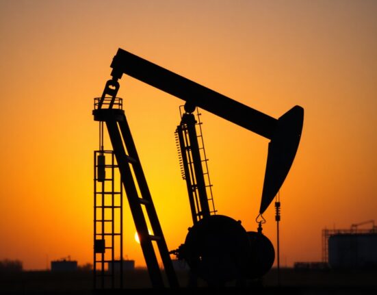 Oil pumpjack silhouette at sunset representing Brent crude market reaction to geopolitical ceasefire news