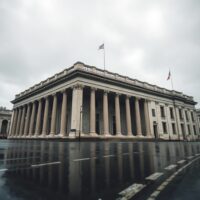 Bank of England building under overcast sky, reflecting cautious monetary policy outlook
