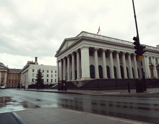 Bank of England building on a cloudy day reflecting political and economic uncertainty