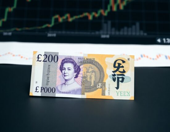 British Pound and Japanese Yen banknotes on a desk, representing forex market analysis.