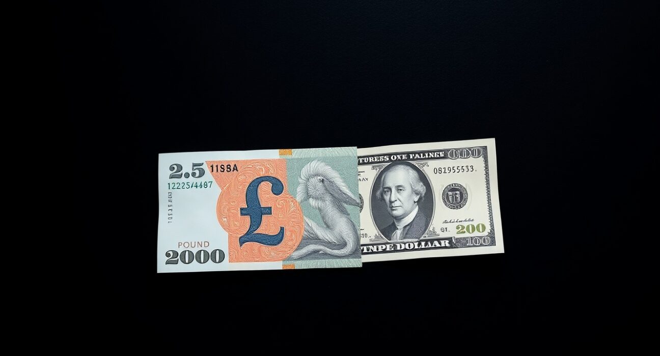 British Pound and US Dollar banknotes representing currency market volatility amid geopolitical tensions