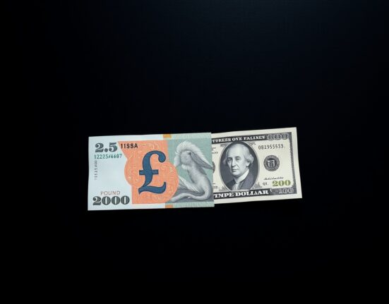 British Pound and US Dollar banknotes representing currency market volatility amid geopolitical tensions
