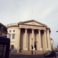 Bank of England building facade on a cloudy day in London financial district