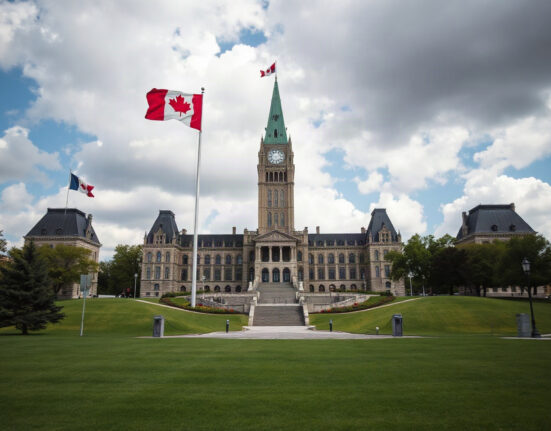 Parliament Buildings in Ottawa, Canada, under a partly cloudy sky