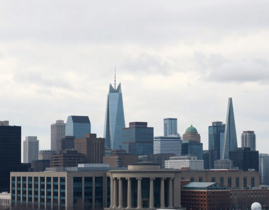 Toronto financial district skyline under overcast sky, representing Canada's economic outlook.