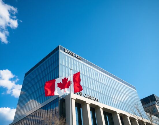 Bank of Canada building on a sunny day with Canadian flag flying, symbolizing monetary policy stability.