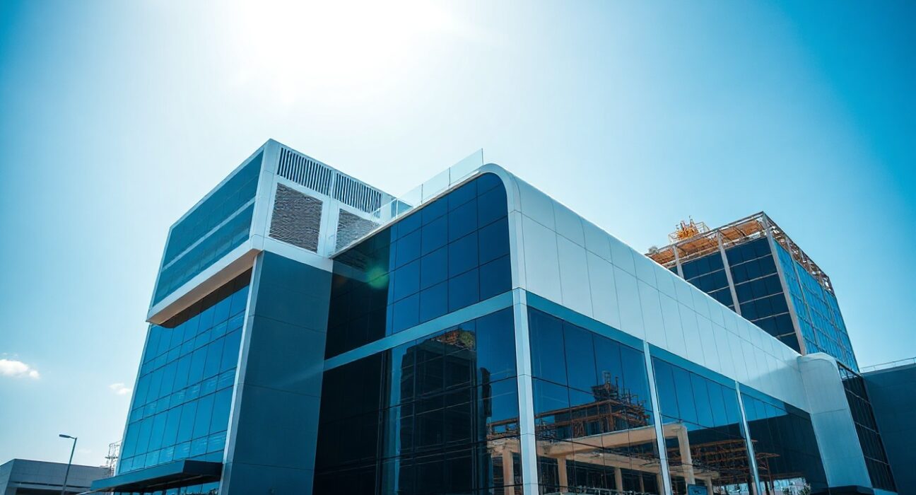 Exterior view of a modern data center campus in India under a clear sky, representing AI infrastructure growth.