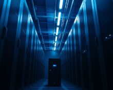 A modern data center with a highlighted compact server unit, symbolizing the shift to smaller, more cost-effective AI models.