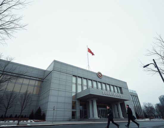 Exterior of the People's Bank of China headquarters in Beijing on a cloudy day.