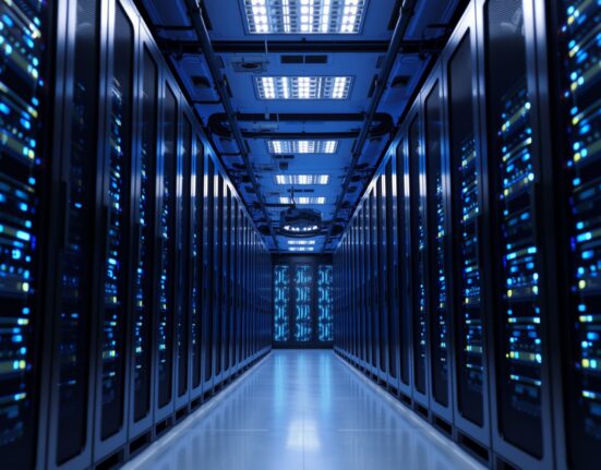 Interior of a modern data center with rows of servers and cool blue lighting