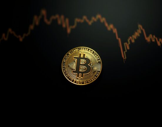 Crypto buying opportunity visualized by a glowing Bitcoin coin on a dark chart background, representing market indifference and a golden entry point.