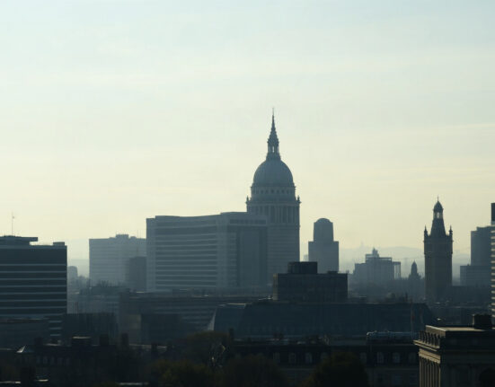 London financial district skyline with Bank of England building, representing UK economic outlook