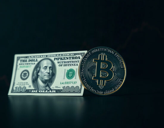 US dollar and Bitcoin coin on a financial chart background