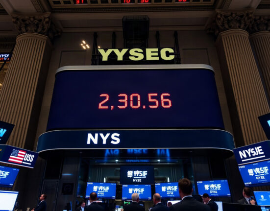 Traders on the NYSE floor as the Dow Jones Industrial Average ignores a revised inflation report