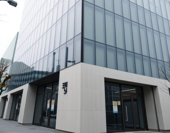 Exterior view of Dunamu's office building in Seoul, South Korea, under overcast daylight.