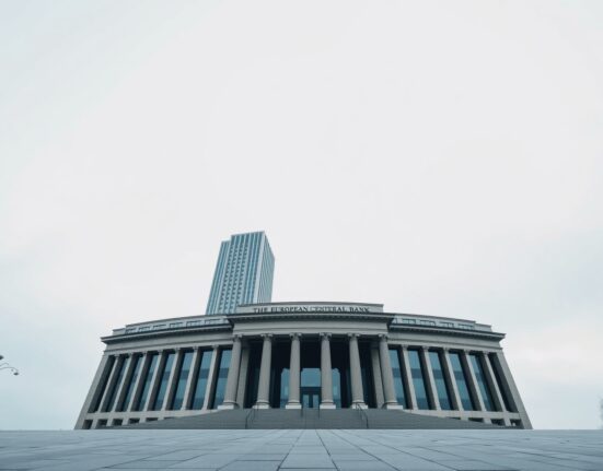 European Central Bank headquarters in Frankfurt, Germany, under an overcast sky.